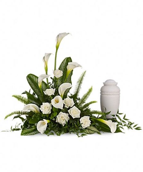 Urn arrangement of all-white calla lilies, roses and more. 