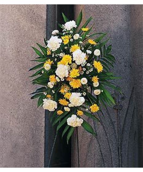 Chrysanthemums and white carnations arranged in a sympathy spray.